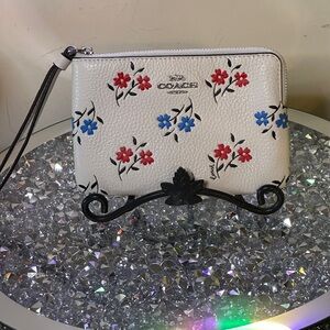 NWT - Coach Corner Zip Wristlet with Floral Print. Retail $138.00
